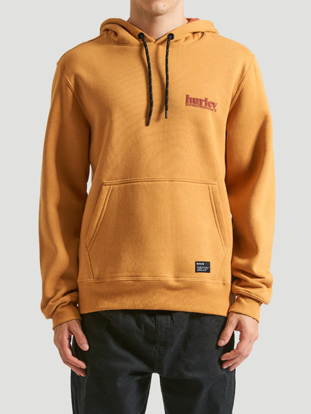 Moletom canguru amarelo mostarda com capuz ajustável por cordão preto, bolso frontal e logo "Hurley" estilizado em relevo no lado esquerdo do peito.
