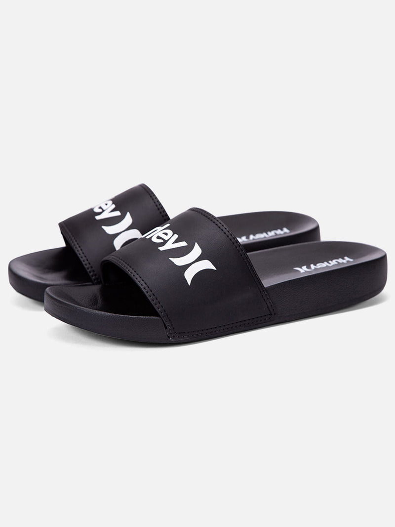 Chinelo slide preto com tira larga e logotipo Hurley em branco, solado anatômico e confortável, ideal para uso casual.